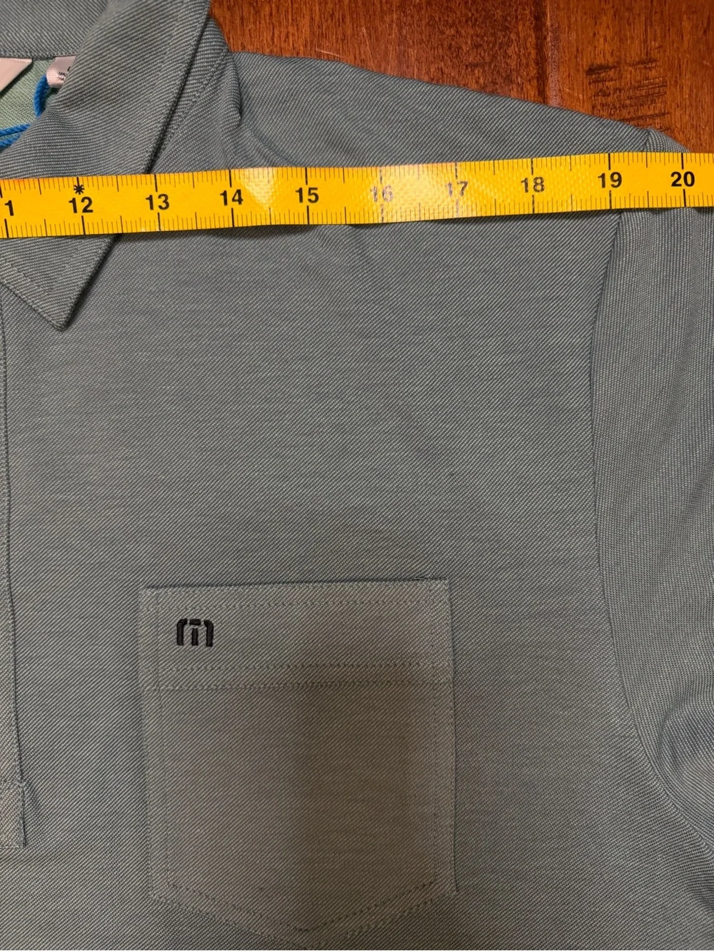 Travis Mathew logo button lightweight